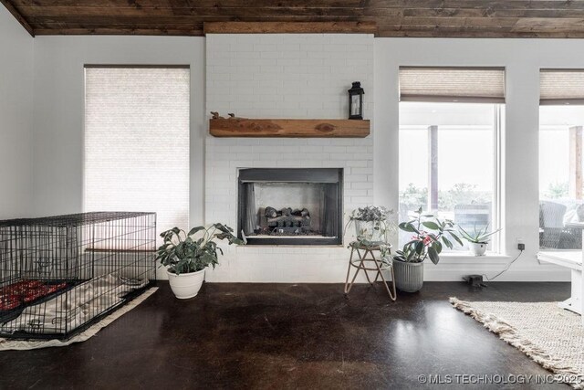 8486 Mcduffee Rd, Kingston, OK 73439 - living area featuring finished concrete floors and a fireplace
