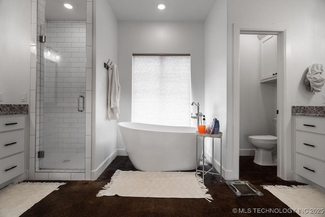8486 Mcduffee Rd, Kingston, OK 73439 - bathroom with a shower stall, a soaking tub, recessed lighting, and vanity