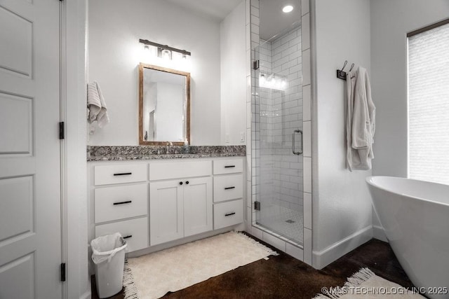 8486 Mcduffee Rd, Kingston, OK 73439 - full bathroom featuring a stall shower, a freestanding tub, vanity, and recessed lighting