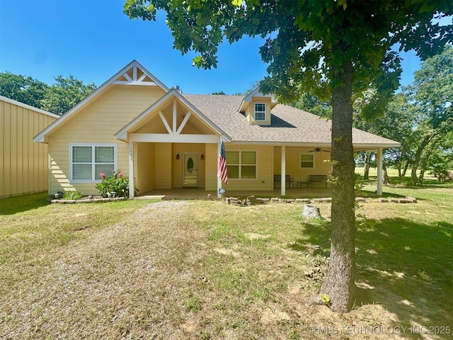 1908 Rhynes-Childress Loop, Kingston, OK 73439 - view of front of house featuring a front yard, a ceiling fan, and roof with shingles