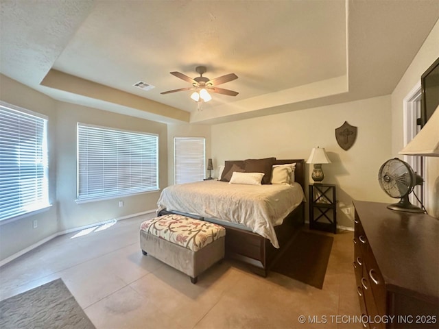 1908 Rhynes-Childress Loop, Kingston, OK 73439 - bedroom featuring a tray ceiling, a ceiling fan, and tile patterned floors