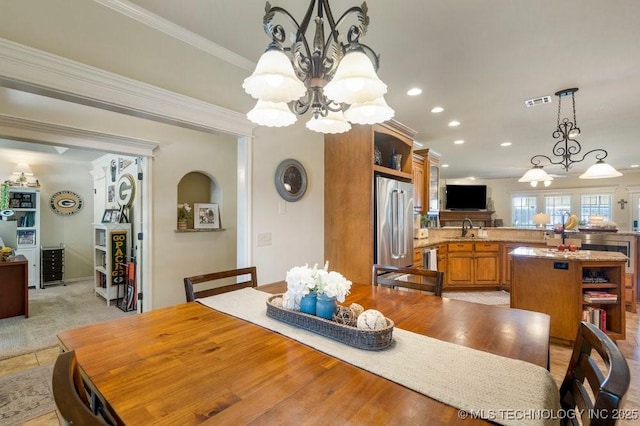 14404 S Florence Ave, Bixby, OK 74008 - dining space featuring a chandelier, recessed lighting, and crown molding