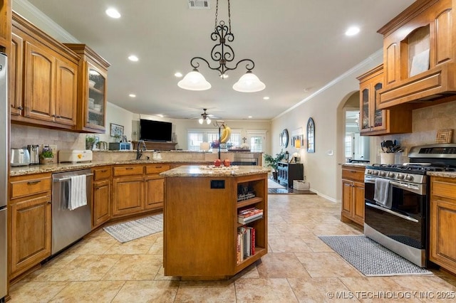14404 S Florence Ave, Bixby, OK 74008 - kitchen with appliances with stainless steel finishes, ceiling fan, decorative backsplash, crown molding, and recessed lighting