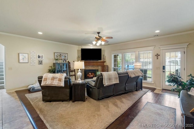 14404 S Florence Ave, Bixby, OK 74008 - living area with a ceiling fan, wood finished floors, a lit fireplace, crown molding, and recessed lighting