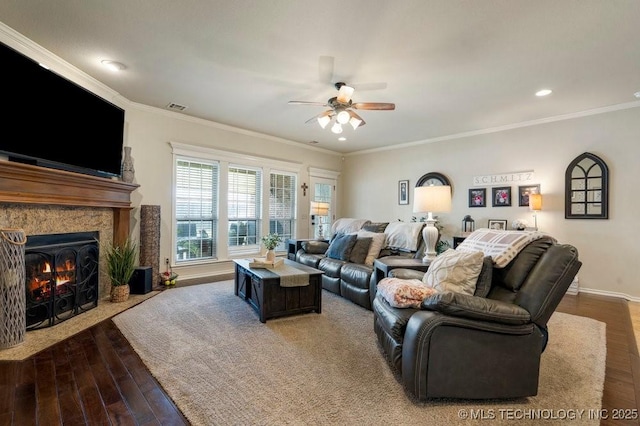 14404 S Florence Ave, Bixby, OK 74008 - living area with a ceiling fan, wood finished floors, ornamental molding, a fireplace with flush hearth, and recessed lighting