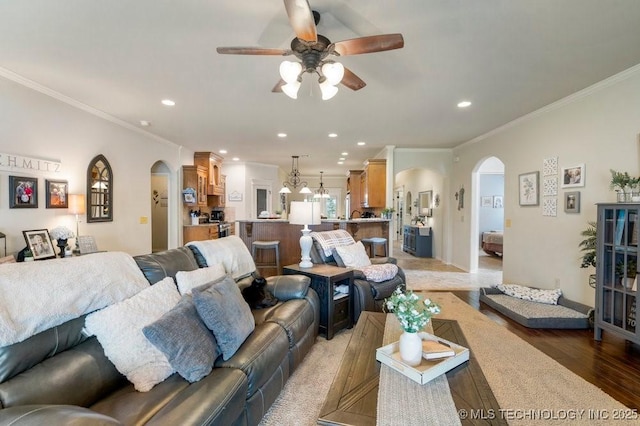 14404 S Florence Ave, Bixby, OK 74008 - living area featuring arched walkways, ceiling fan, ornamental molding, light wood-type flooring, and recessed lighting