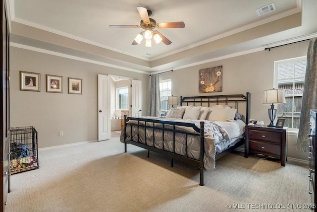 14404 S Florence Ave, Bixby, OK 74008 - carpeted bedroom with a raised ceiling, ornamental molding, connected bathroom, and a ceiling fan