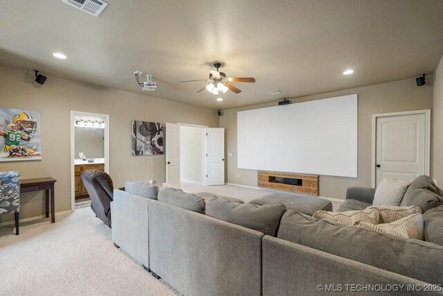 14404 S Florence Ave, Bixby, OK 74008 - cinema featuring ceiling fan, light carpet, and recessed lighting