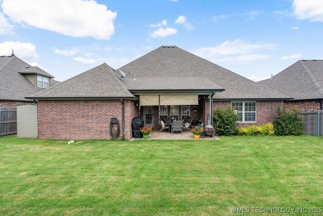 14404 S Florence Ave, Bixby, OK 74008 - back of property with brick siding, a fenced backyard, a patio, and roof with shingles