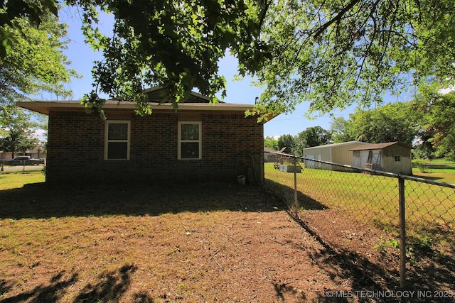 1518 E Hogner St, Tahlequah, OK 74464 - view of side of property featuring brick siding