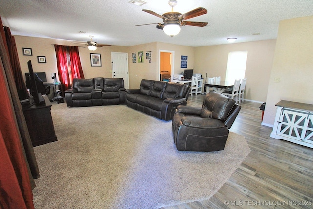 1518 E Hogner St, Tahlequah, OK 74464 - living area featuring a ceiling fan, wood finished floors, a textured ceiling, and an office area