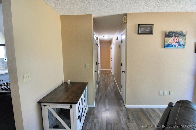 1518 E Hogner St, Tahlequah, OK 74464 - hallway featuring dark wood finished floors and a textured ceiling