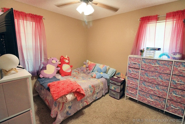 1518 E Hogner St, Tahlequah, OK 74464 - carpeted bedroom with ceiling fan and a textured ceiling