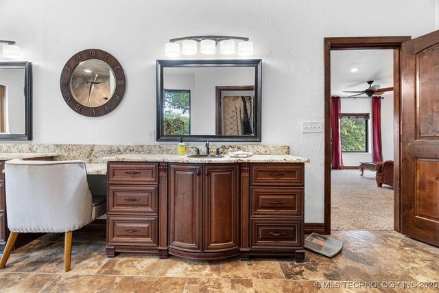 9094 Waters Edge, Kingston, OK 73439 - full bathroom featuring stone finish floors, vanity, and a ceiling fan