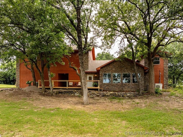 9094 Waters Edge, Kingston, OK 73439 - back of house with stone siding, a lawn, and a deck