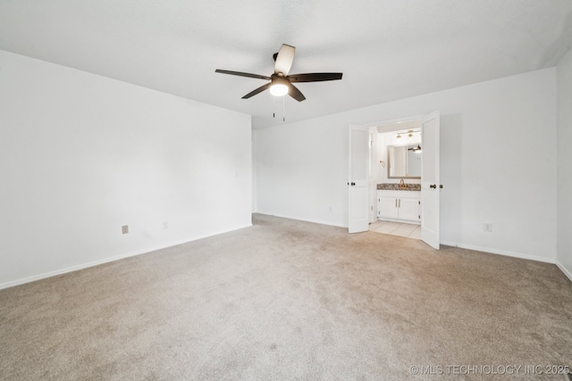 6947 S 30th W Ave, Tulsa, OK 74132 - spare room featuring ceiling fan and light colored carpet