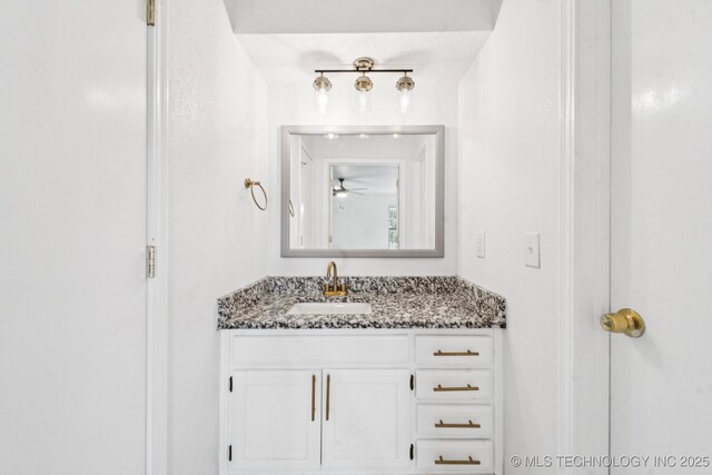 6947 S 30th W Ave, Tulsa, OK 74132 - bathroom featuring vanity and a ceiling fan