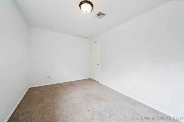6947 S 30th W Ave, Tulsa, OK 74132 - spare room featuring carpet floors and attic access