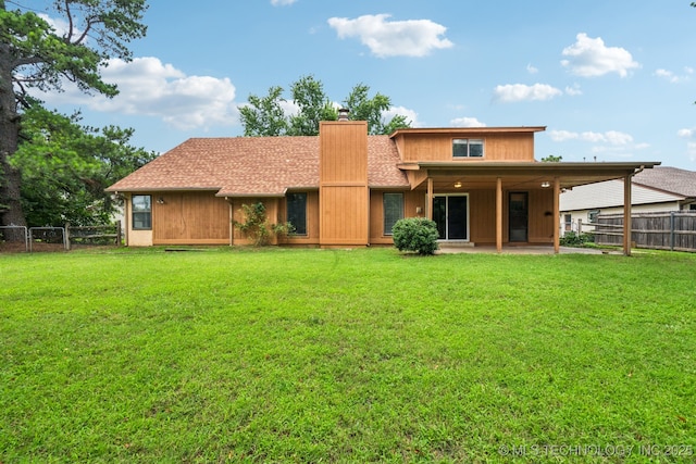 6947 S 30th W Ave, Tulsa, OK 74132 - back of property with a chimney, a fenced backyard, a patio, and roof with shingles