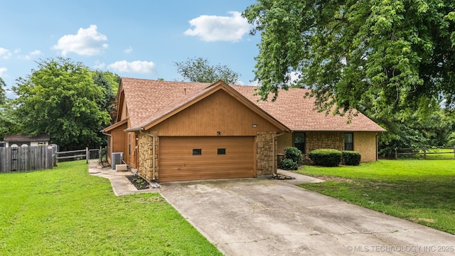 6947 S 30th W Ave, Tulsa, OK 74132 - view of front of property featuring stone siding, a garage, and driveway