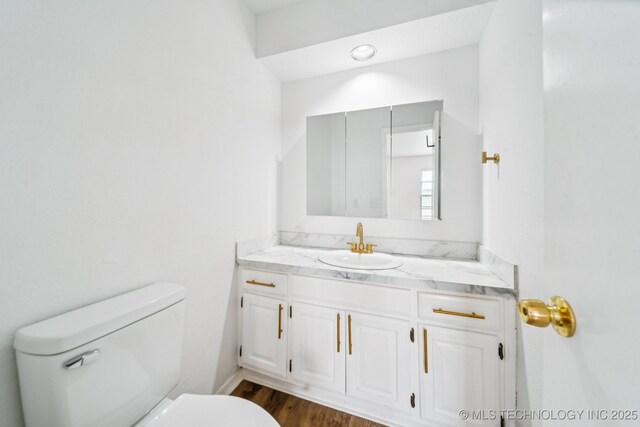 6947 S 30th W Ave, Tulsa, OK 74132 - half bath featuring vanity and wood finished floors