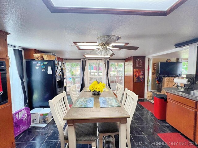 98224 S 4489th Rd, Vian, OK 74962 - dining room with a textured ceiling, dark tile patterned flooring, and ceiling fan