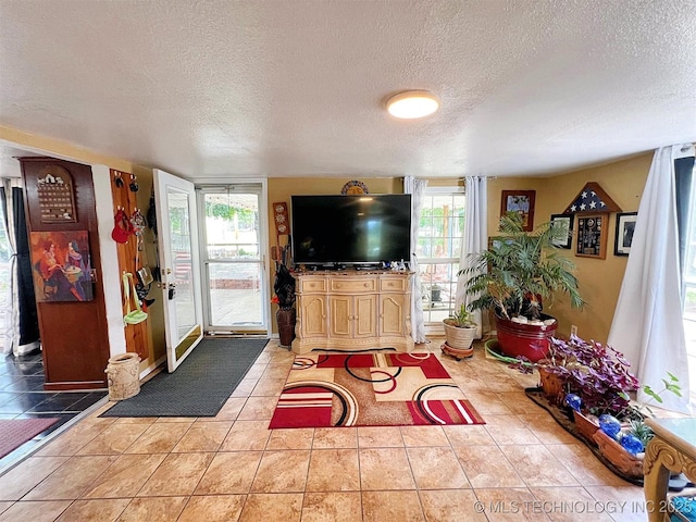 98224 S 4489th Rd, Vian, OK 74962 - tiled living room featuring a textured ceiling