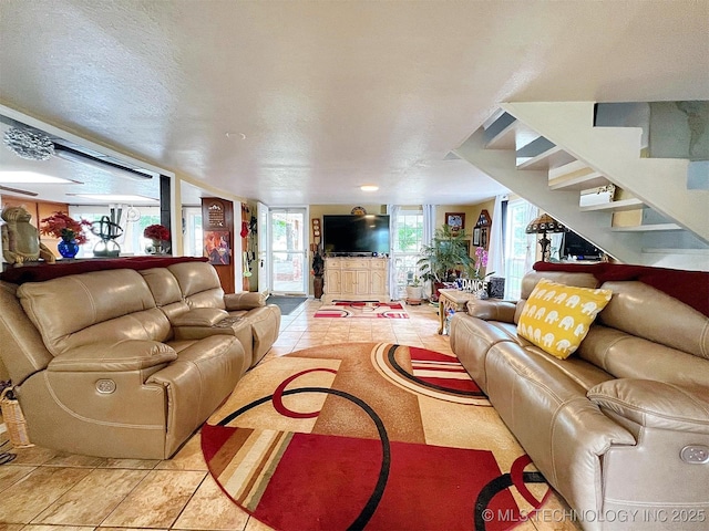 98224 S 4489th Rd, Vian, OK 74962 - living area featuring light tile patterned flooring and stairs