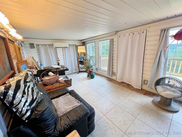 98224 S 4489th Rd, Vian, OK 74962 - living room featuring a wall mounted AC, wood walls, and light tile patterned floors
