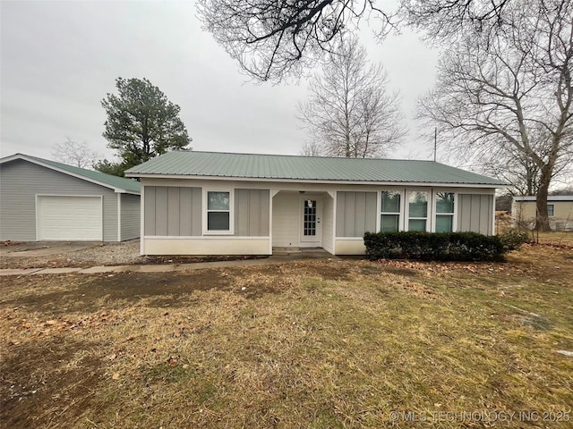 23308 W 171st St, Kellyville, OK 74039 - single story home featuring board and batten siding, a porch, a metal roof, and a front lawn