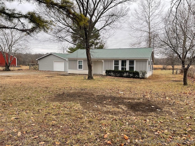 23308 W 171st St, Kellyville, OK 74039 - single story home with board and batten siding, a metal roof, and an attached garage
