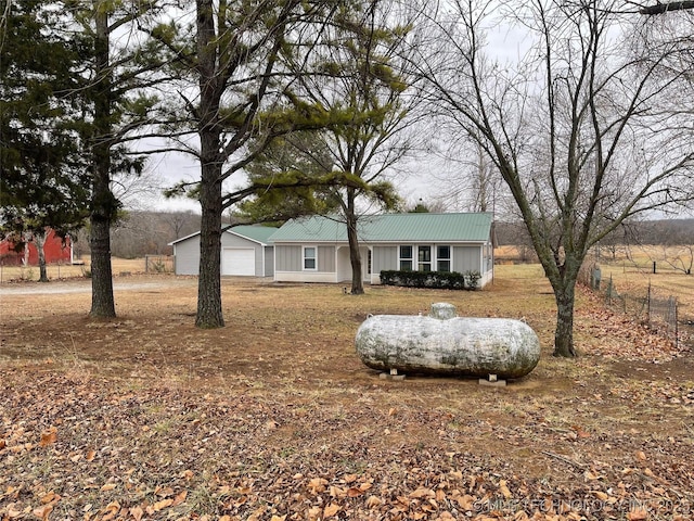 23308 W 171st St, Kellyville, OK 74039 - ranch-style home featuring a metal roof, a garage, and board and batten siding