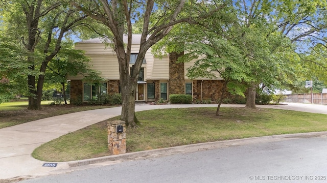 10958 S Richmond Ave, Tulsa, OK 74137 - view of front facade featuring curved driveway and brick siding