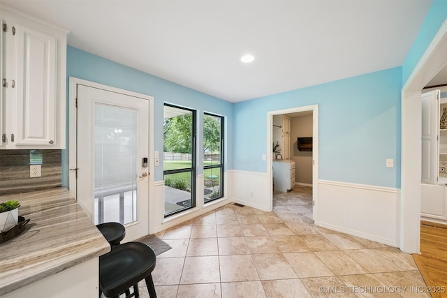 10958 S Richmond Ave, Tulsa, OK 74137 - entryway with a wainscoted wall