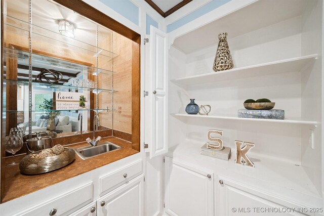 10958 S Richmond Ave, Tulsa, OK 74137 - indoor wet bar featuring ornamental molding