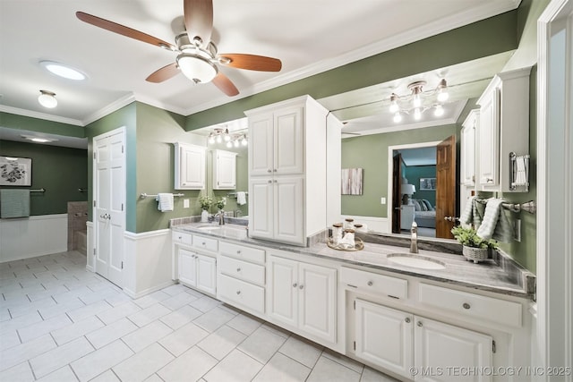 10958 S Richmond Ave, Tulsa, OK 74137 - full bathroom featuring double vanity, ensuite bath, ornamental molding, a chandelier, and ceiling fan