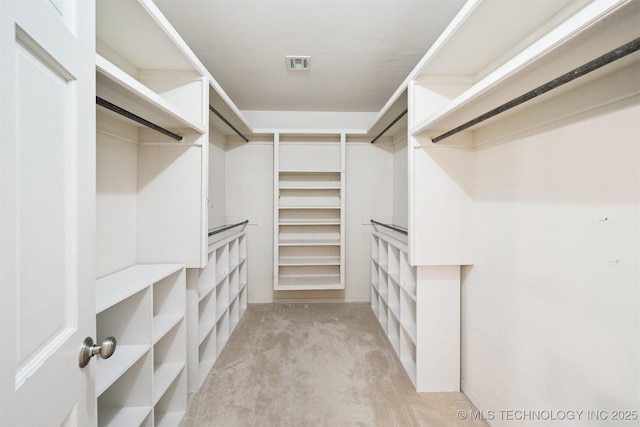 10958 S Richmond Ave, Tulsa, OK 74137 - walk in closet featuring light carpet