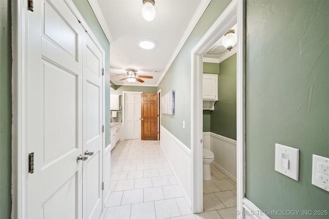 10958 S Richmond Ave, Tulsa, OK 74137 - hall featuring ornamental molding, light tile patterned flooring, and a wainscoted wall