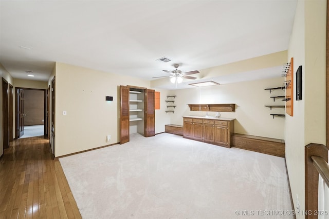 10958 S Richmond Ave, Tulsa, OK 74137 - unfurnished living room featuring ceiling fan, light wood-type flooring, and light carpet