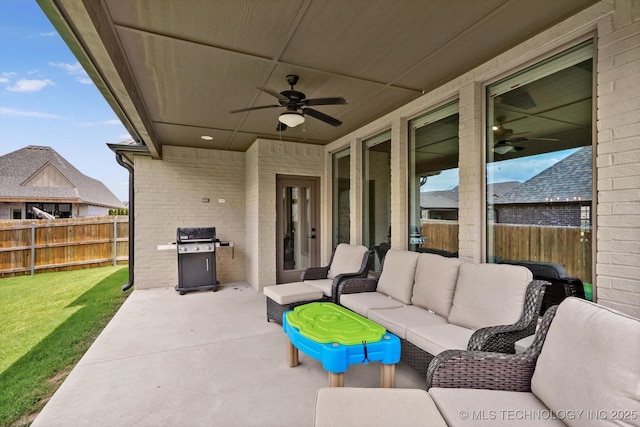 14505 E 79th St, Owasso, OK 74055 - fenced backyard with a ceiling fan, an outdoor living space, a patio area, and grilling area
