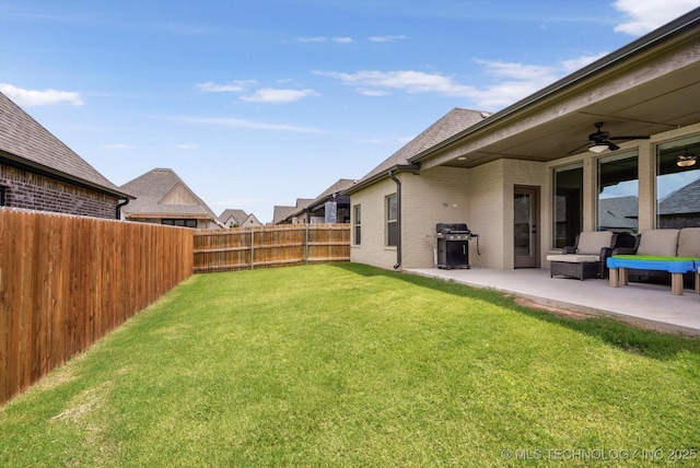 14505 E 79th St, Owasso, OK 74055 - fenced backyard with a patio area and a ceiling fan