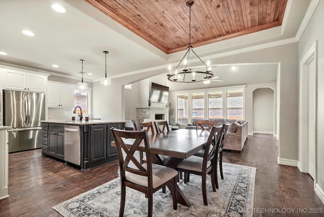 14505 E 79th St, Owasso, OK 74055 - dining space with wooden ceiling, a chandelier, dark wood finished floors, recessed lighting, and a fireplace