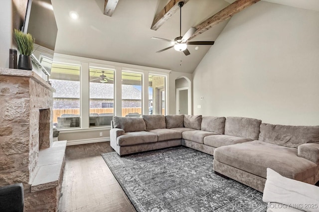 14505 E 79th St, Owasso, OK 74055 - living area featuring ceiling fan, wood finished floors, arched walkways, beam ceiling, and high vaulted ceiling