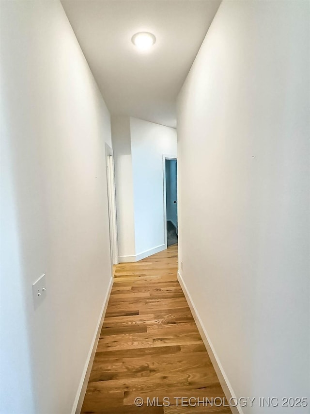 5657 E 141st Pl N, Collinsville, OK 74021 - hallway featuring light wood-style flooring and baseboards