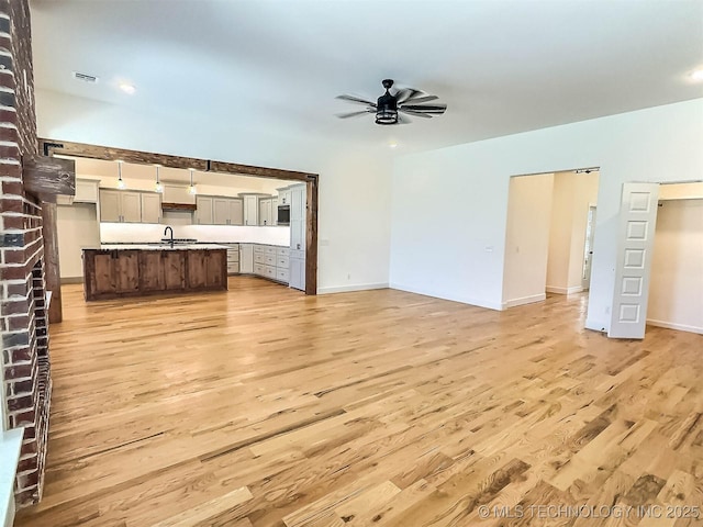 5657 E 141st Pl N, Collinsville, OK 74021 - unfurnished living room with light wood-style flooring, ceiling fan, and recessed lighting