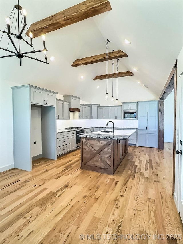 5657 E 141st Pl N, Collinsville, OK 74021 - kitchen with high vaulted ceiling, a chandelier, stainless steel appliances, beam ceiling, and light wood-type flooring