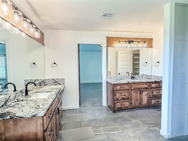 5657 E 141st Pl N, Collinsville, OK 74021 - full bath with two vanities and baseboards
