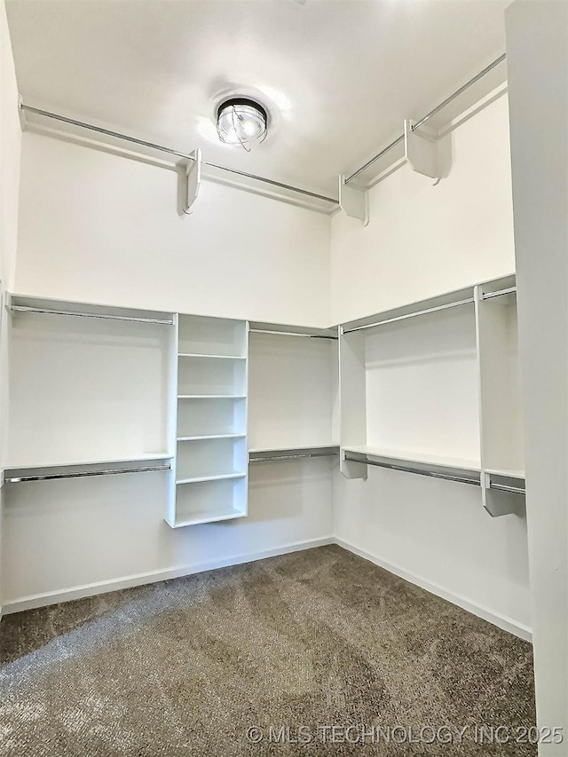 5657 E 141st Pl N, Collinsville, OK 74021 - walk in closet featuring dark colored carpet