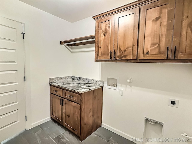 5657 E 141st Pl N, Collinsville, OK 74021 - laundry room featuring hookup for an electric dryer, hookup for a gas dryer, cabinet space, and hookup for a washing machine