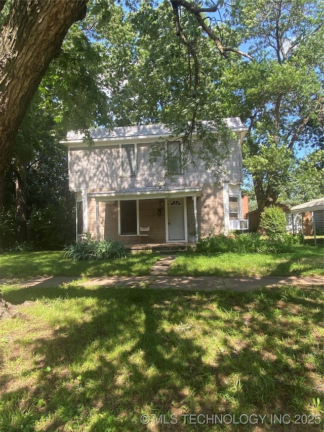 103 S Dunlap St, Cleveland, OK 74020 - view of front of home featuring a front yard